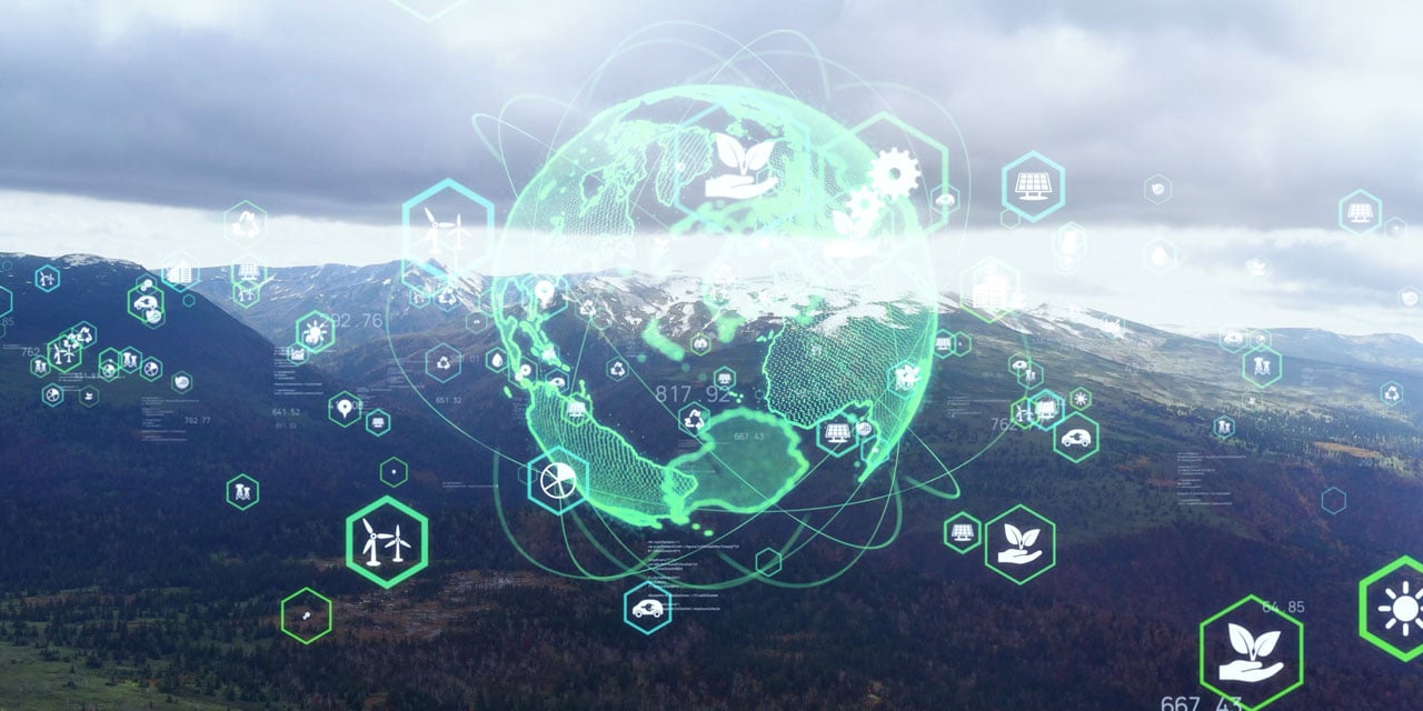 Abstract globe and illustrations of windmills, sun, and plants superimposed upon a mountainous landscape