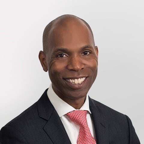 Rodney Jones-Tyson professional headshot with gray background.