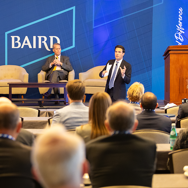  Baird associates presenting at a conference